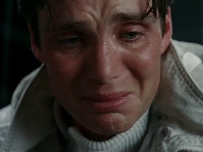 Cillian Murphy in a scene from "Inception" where Robert Fischer is crying.