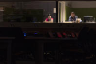 Translators work in an empty conference room during the 75th session of the United Nations General Assembly, Wednesday, Sept. 23, 2020, at U.N. headquarters. This year's annual gathering of world leaders at U.N. headquarters will be almost entirely "virtual." Leaders have been asked to pre-record their speeches, which will be shown in the General Assembly chamber, where each of the 193 U.N. member nations are allowed to have one diplomat present. (AP Photo/Mary Altaffer)