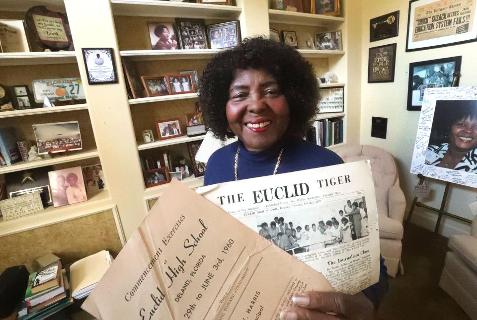 Joyce Cusack, who was Joyce Cummings until she got married in 1961, is pictured holding a program from her high school graduation in 1960. She's also holding a copy of her DeLand high school's student newspaper, The Euclid Tiger, of which she was the managing editor. A few months before she graduated from the Euclid School, which had an all-Black student body, she and a few dozen of her classmates staged peaceful protests at two DeLand lunch counters that wouldn't let Black people eat or drink inside.