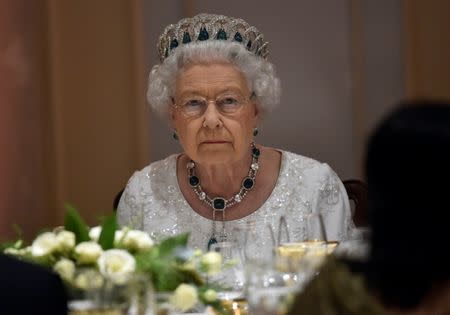 Britain's Queen Elizabeth looks around as she attends a dinner at the Corinthia Palace Hotel in Attard, Malta, November, 27, 2015 during the Commonwealth Heads of Government Meeting (CHOGM). REUTERS/Toby Melville