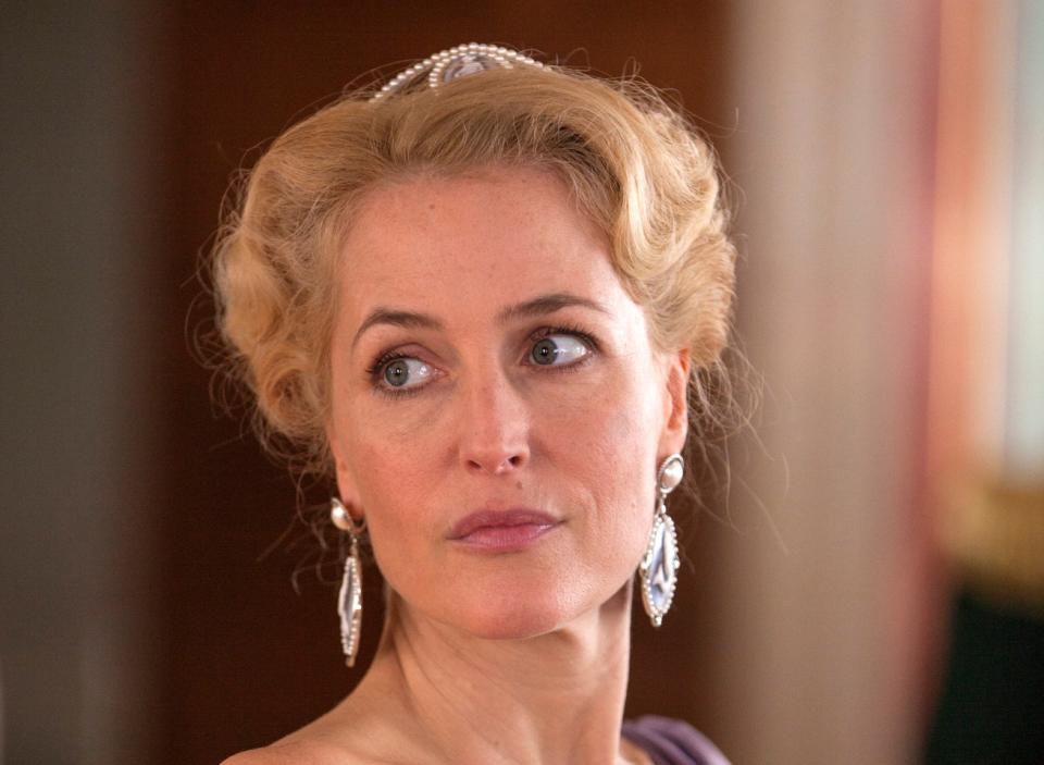 Gillian Anderson as Anna Pavlovna wearing a crown.