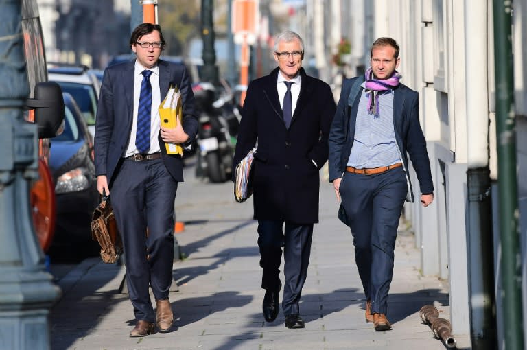 Flemish Minister-President of Belgium's Flemish region Geert Bourgeois (C) arrives to attend an emergency meeting of all Belgium federal entities on the EU-Canada Comprehensive Economic and Trade Agreement in Brussels on October 26, 2016