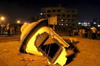 Debris is seen on the ground after a bomb blast at a national security building in Shubra Al-Khaima on the outskirts of Cairo, Egypt August 20, 2015. At least six people were wounded early on Thursday in the car bombing near the state security building and courthouse in the Cairo suburb, security sources said. (REUTERS/Mohamed Abd El Ghany)