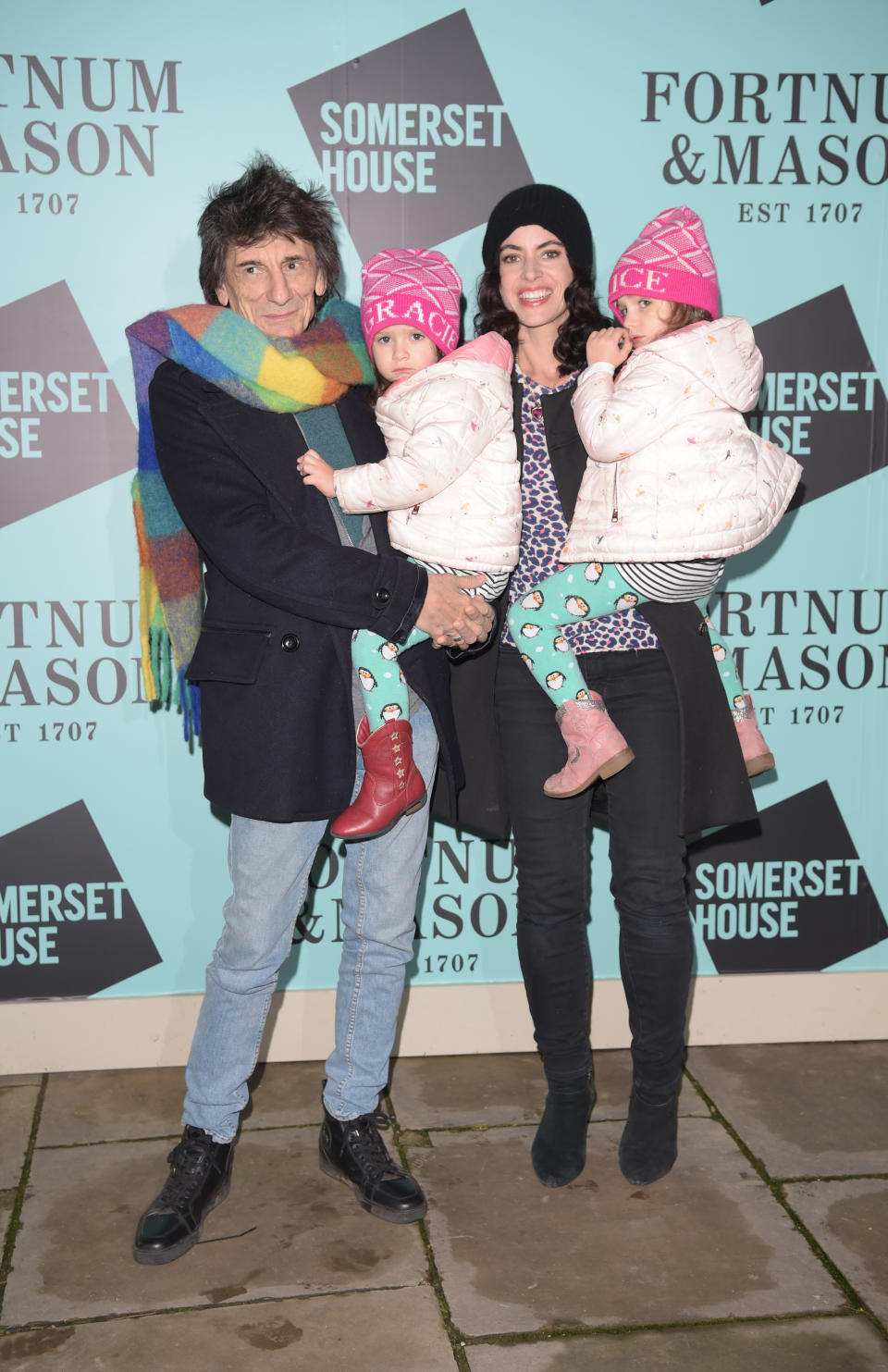 Ronnie Wood and Sally Wood with twins Gracie Jane and Alice Rose attend the opening party of Skate  at Somerset House on November 12, 2019 in London, England. (Photo by David M. Benett/Dave Benett/Getty Images for Fortnum & Mason)