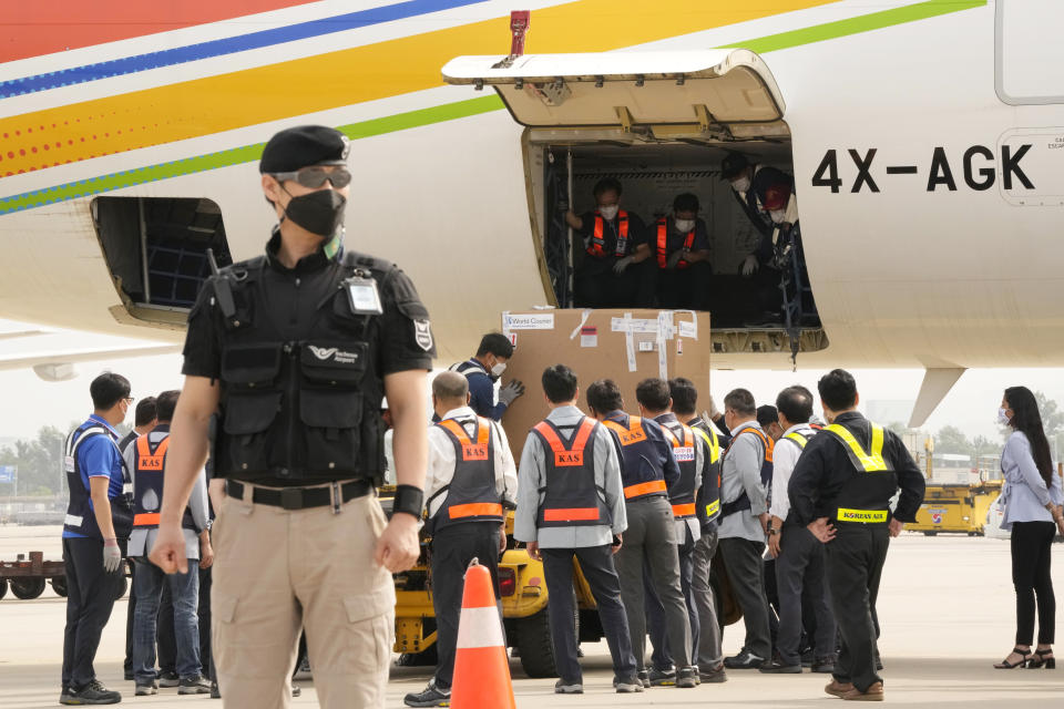 A batch of the Pfizer COVID-19 vaccines sent by Israel is unloaded at the Incheon International Airport in Incheon, South Korea, Wednesday, July 7, 2021. South Korea on Wednesday received 700,000 Pfizer shots from Israel in exchange for a future shipment of vaccines to Israel from September to November, when officials hope South Korea's shortage will have eased. (AP Photo/Ahn Young-joon)