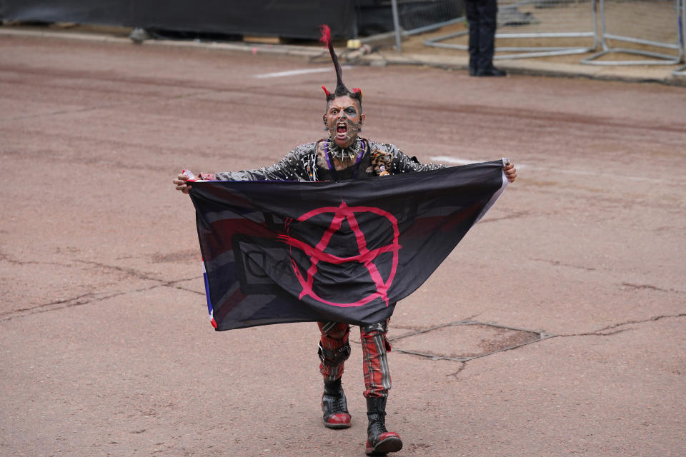 A participant dressed as a punk during the Platinum Jubilee Pageant in front of Buckingham Palace, London, on day four of the Platinum Jubilee celebrations. Picture date: Sunday June 5, 2022.