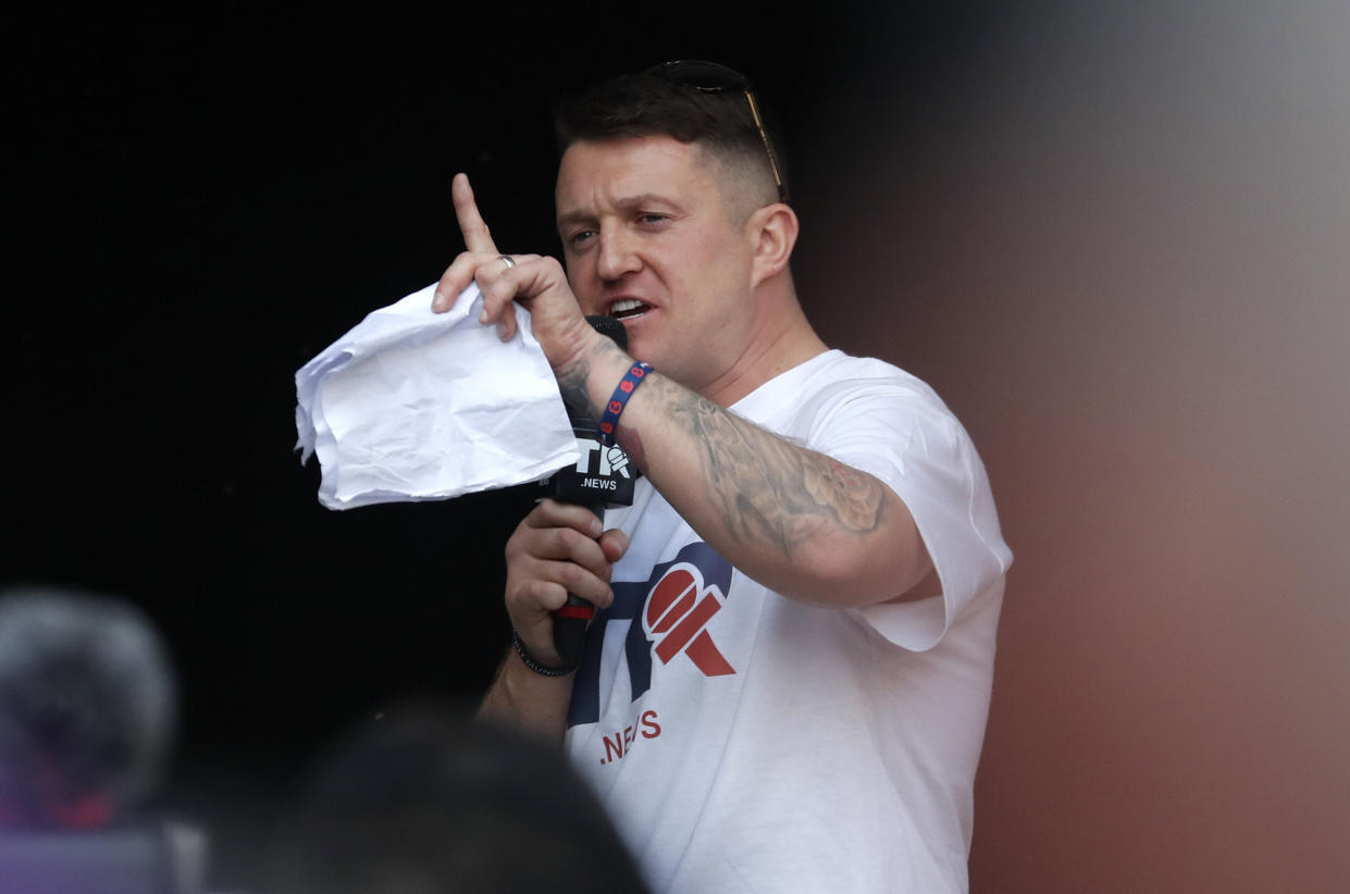 British far-right activist Tommy Robinson speaks during a rally in Parliament Square after the final leg of the "March to Leave" in London, Friday, March 29, 2019. Pro-Brexit demonstrators were gathering in central London on the day that Britain was originally scheduled to leave the European Union. (AP Photo/ Frank Augstein)