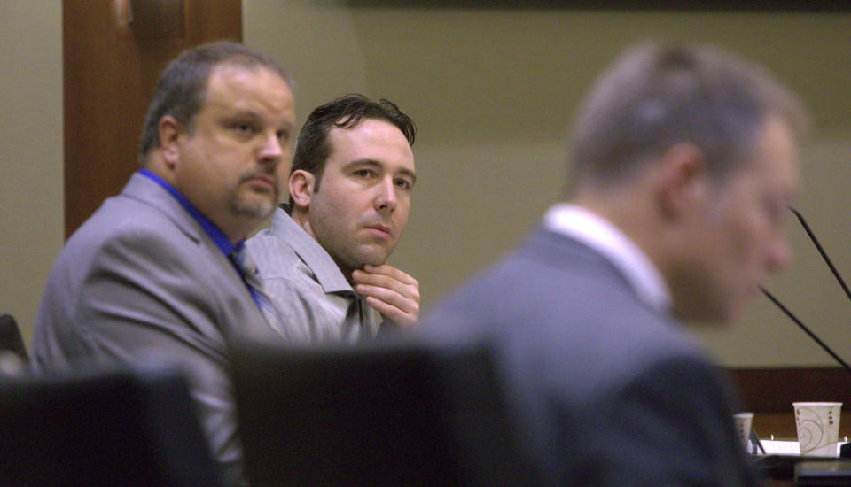 William Hoehn, center, listens to the charges read against him on Wednesday, Sept. 19, 2018, in Fargo, N.D., for the murder of Savanna LaFontaine-Greywind, a 22-year-old whoss baby was cut from her womb. Hoehn is charged with conspiracy to commit murder in the death of 22-year-old Savanna Greywind, who was eight months pregnant when she was killed in August 2017. (Michael Vosburg/The Forum via AP, Pool)