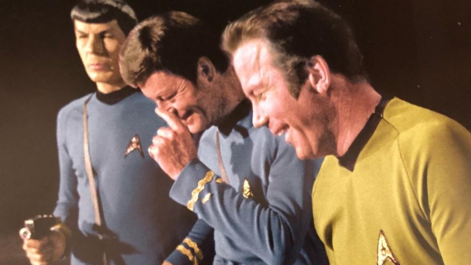 Leonard Nimoy, DeForest Kelley, and William Shatner break out into laughter in a blooper from the original Star Trek series. 