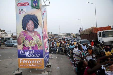 A banner for the campaign of presidential candidate Elisabeth Agbossaga is displayed along a road in the Stade-Kouhounou district in Cotonou, Benin March 4, 2016. The banner reads 'Women, I am your solution'. REUTERS/Akintunde Akinleye