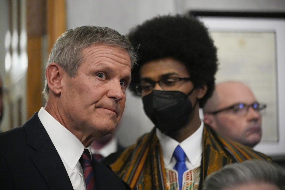 Gov. Bill Lee, left, listens to Rep. Justin J. Pearson, D-Memphis, right, as Lee arrives to deliver his State of the State address in the House chamber Monday, Feb. 5, 2024, in Nashville, Tenn. (AP Photo/George Walker IV)