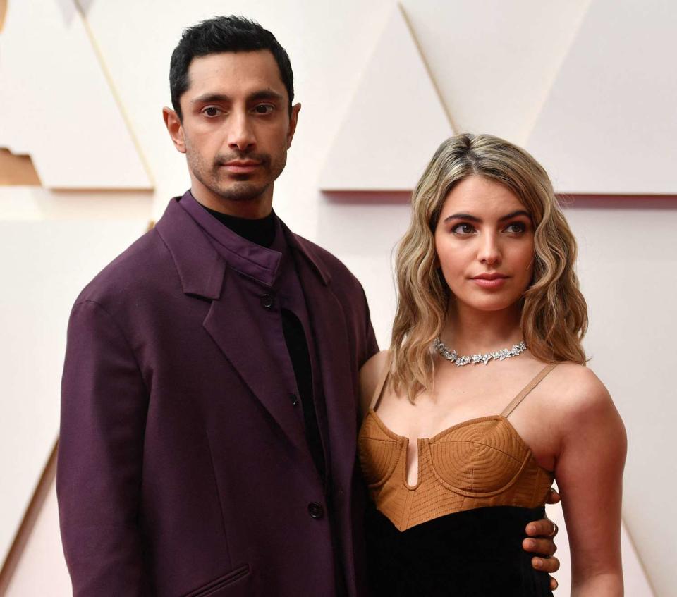 Riz Ahmed (L) and his wife, Fatima Farheen Mirza, attend the 94th Oscars at the Dolby Theatre in Hollywood, California on March 27, 2022