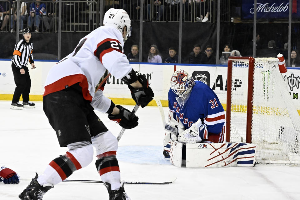 New York Rangers goaltender Igor Shesterkin (31) stops a shot by Ottawa Senators left wing Parker Kelly (27) during the first period of an NHL hockey game Monday, April 15, 2024, at Madison Square Garden in New York. (AP Photo/Bill Kostroun)