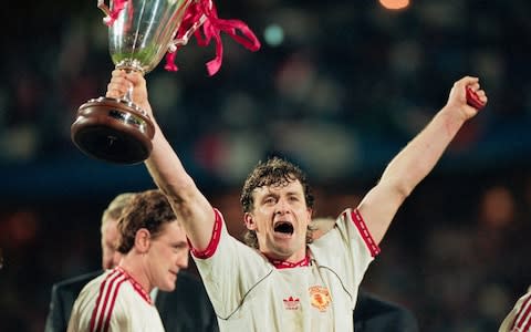 Manchester United striker Mark Hughes celebrates with the trophy - Credit: DAVID CANNON