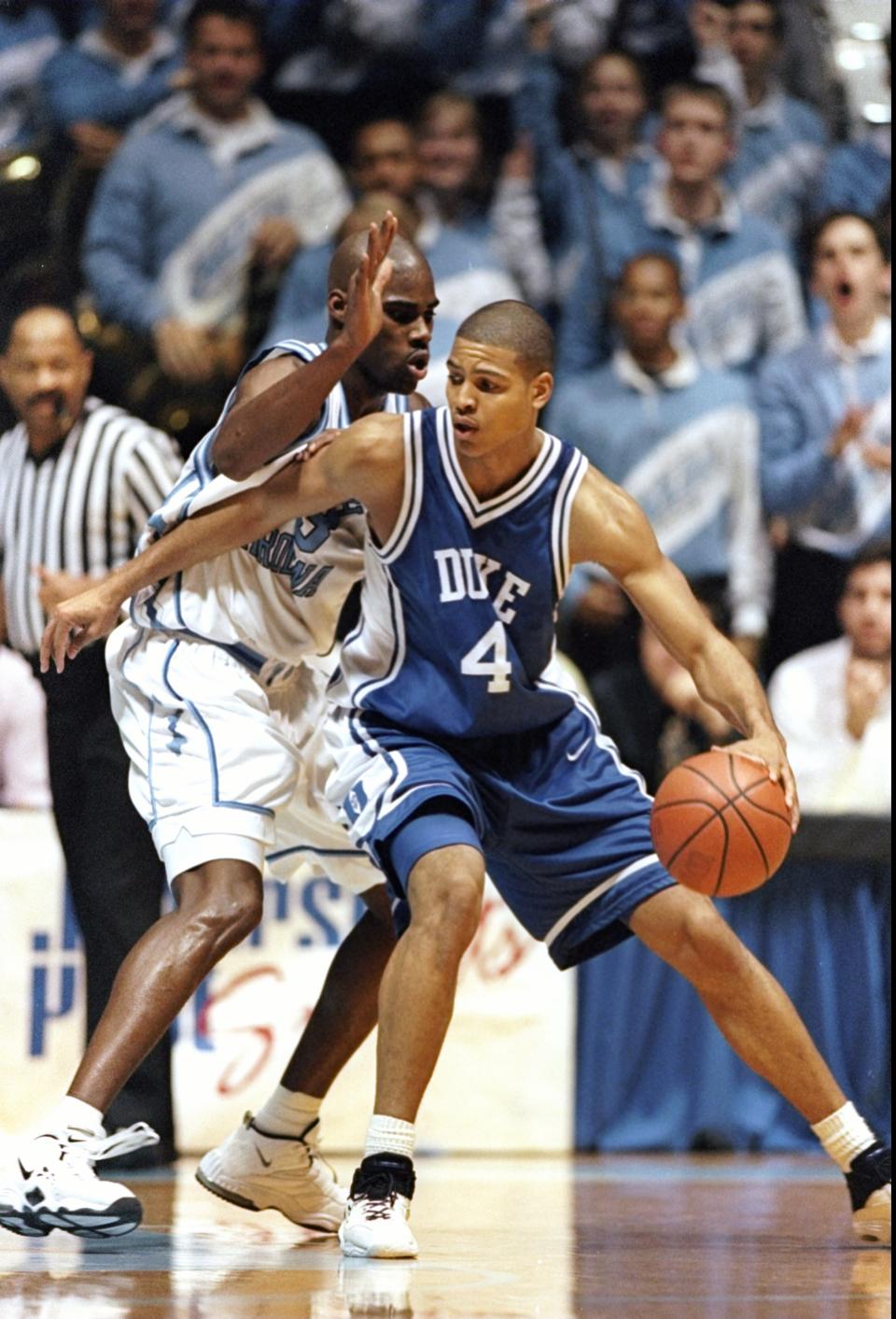 5 Feb 1998: Forward Roshawn McLeod of the Duke Blue Devils moves the ball as forward Antawn Jamison of the North Carolina Tar Heels covers him during a game at the Dean Smith Center in Chapel Hill, North Carolina. UNC won the game, 97-73. Mandatory Cred