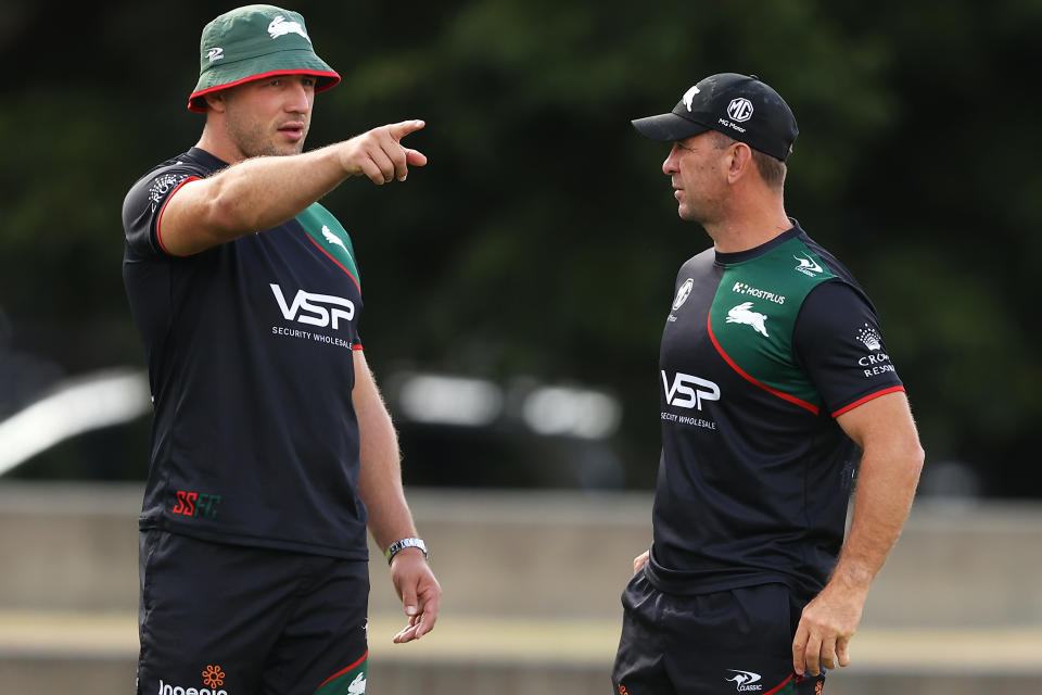 SYDNEY, AUSTRALIA - MARCH 13: Sam Burgess speaks to Rabbitohs head coach Jason Demetriou during a South Sydney Rabbitohs NRL training session at Redfern Oval on March 13, 2023 in Sydney, Australia. (Photo by Mark Kolbe/Getty Images)