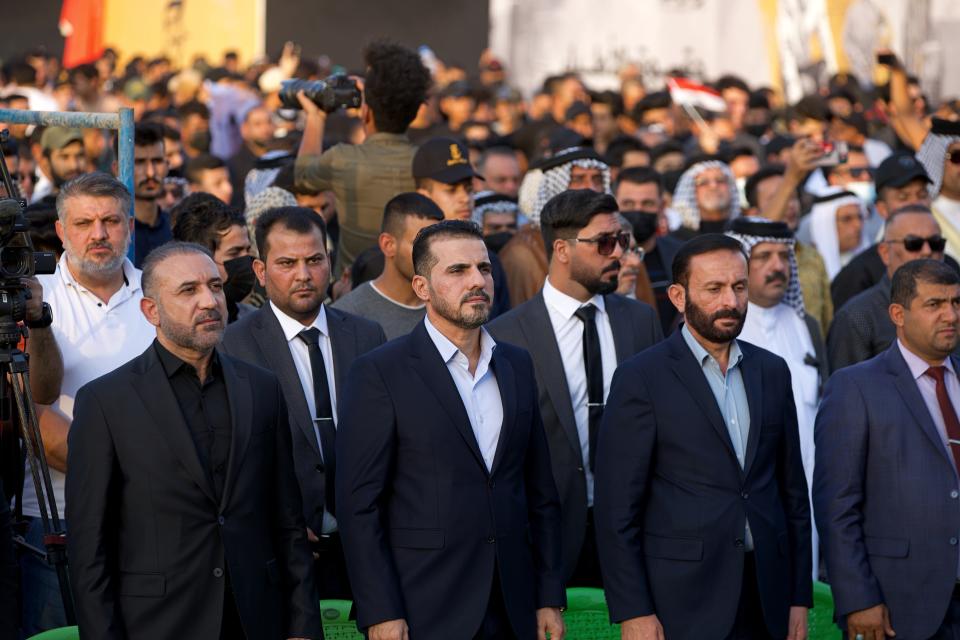 Hussein Muanis, the leader of a political movement called "Harakat Huqooq, Arabic for Rights Movement, center left, attends an election rally before the upcoming parliamentary elections in Baghdad, Iraq, Friday, Sept. 3, 2021. Muanis is the leader of Kataeb Hezbollah, one of the most hard-line and powerful militias with close ties to Iran, who once battled U.S. troops. He is the first to be openly affiliated with Kataeb Hezbollah or Hezbollah Brigades, signaling the militant group’s formal entry into politics. (AP Photo/Hadi Mizban)