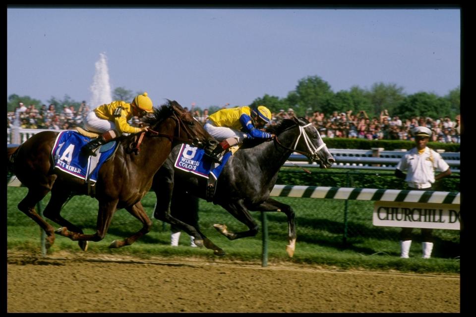 The filly Winning Colors comes in first and Forty Niner second during the 1988 Kentucky Derby.