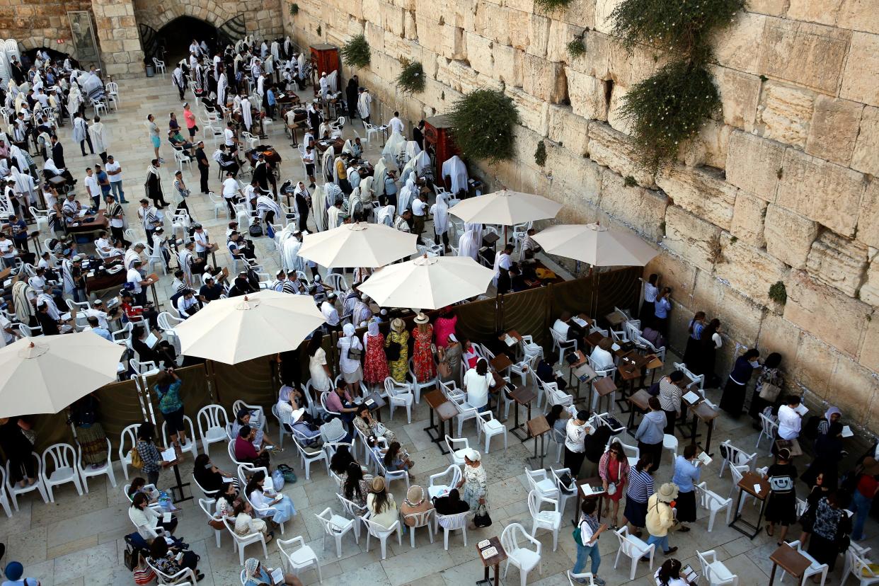 Jewish women pray at the women&#39;s section, on the right, which is separated from the men&#39;s section of the Western Wall.