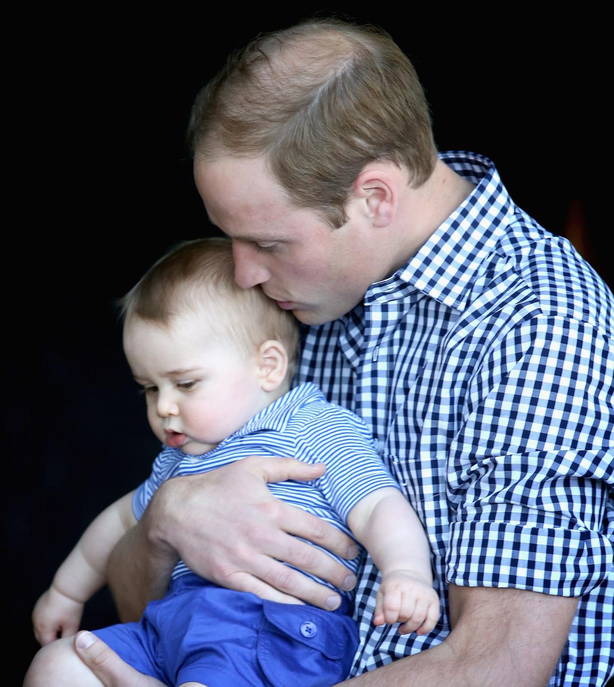 Prince William kisses Prince George at Taronga Zoo on April 20, 2014 in Sydney.