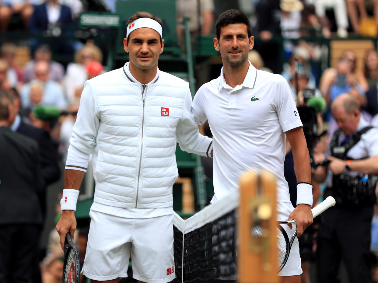 Novak Djokovic and Roger Federer ahead of the men's singles final on day thirteen of the Wimbledon Championships at the All England Lawn Tennis and Croquet Club, Wimbledon. (Photo by Mike Egerton/PA Images via Getty Images)