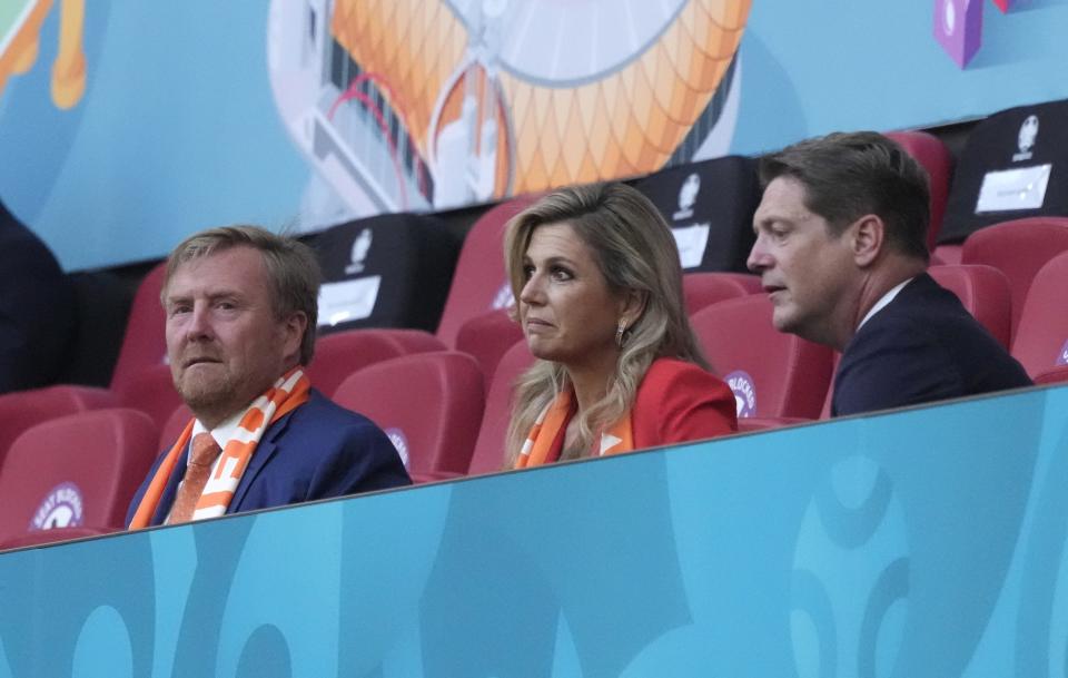 King Willem-Alexander, left, and his spouse Queen Maxima, centre, take their seats ahead of the Euro 2020 soccer championship group C match between the Netherlands and Ukraine at the Johan Cruijff Arena in Amsterdam, Netherlands, Sunday, June 13, 2021. (AP Photo/Peter Dejong, Pool)