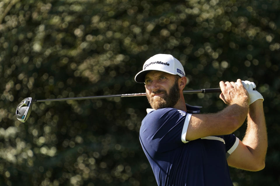 Dustin Johnson watches his tee shot on the 14th hole during the second round of the Masters. (AP Photo/David J. Phillip)