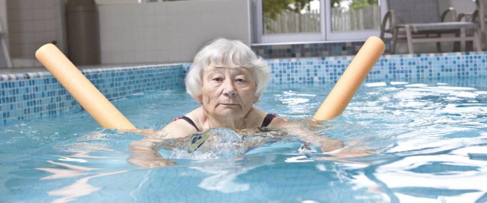 Senior woman aqua fitness