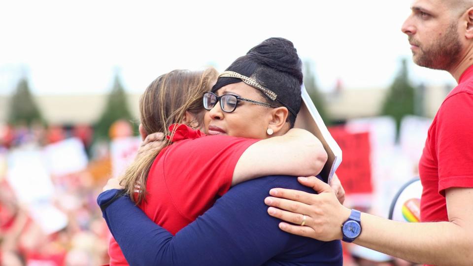 julvonnia mcdowell hugs another gun safety volunteer after losing her son, jajuan, to an unintentional shooting