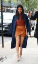 <p>We love this fall-ready outfit where Munn mixes two burnt-orange shades and royal blue. <i>(Photo by Splash News)</i></p>