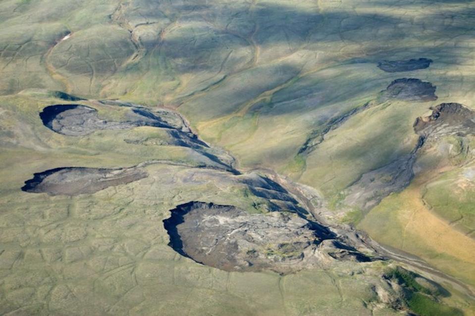 Slumping hillsides show how easily thermokarst landscape erodes in Canada’s Aulavik National Park. <a href="https://www.arcus.org/witness-the-arctic/2019/4/highlight/2" rel="nofollow noopener" target="_blank" data-ylk="slk:Sarah Beattie/Parks Canada;elm:context_link;itc:0;sec:content-canvas" class="link ">Sarah Beattie/Parks Canada</a>