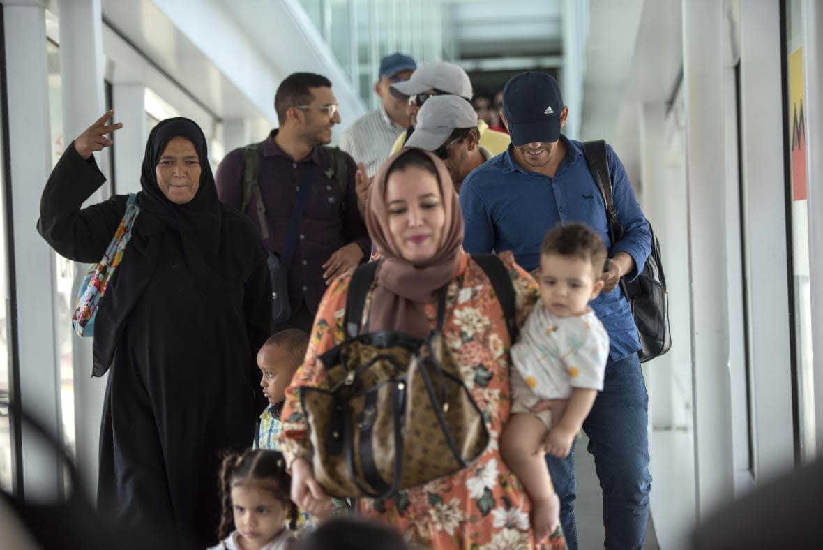 Moroccan citizens repatriated from Sudan, arrive to the Mohammed V International Airport, in Casablanca, Morocco, Wednesday April 26, 2023. (AP Photo)