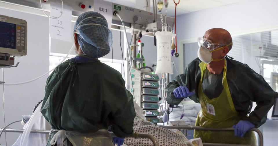 <p>Doctors treat a patient suffering from coronavirus on an Intensive Care ward at Frimley Park Hospital in Surrey. </p>PA