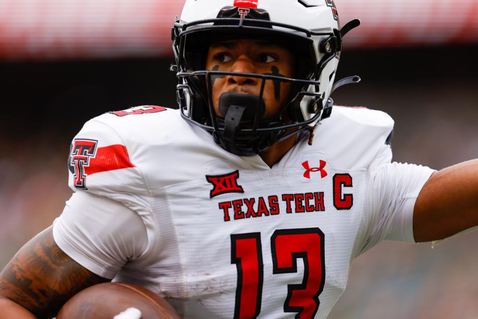 Texas Tech's Erik Ezukanma looks for yards against Baylor Nov. 27, 2021 in Waco.