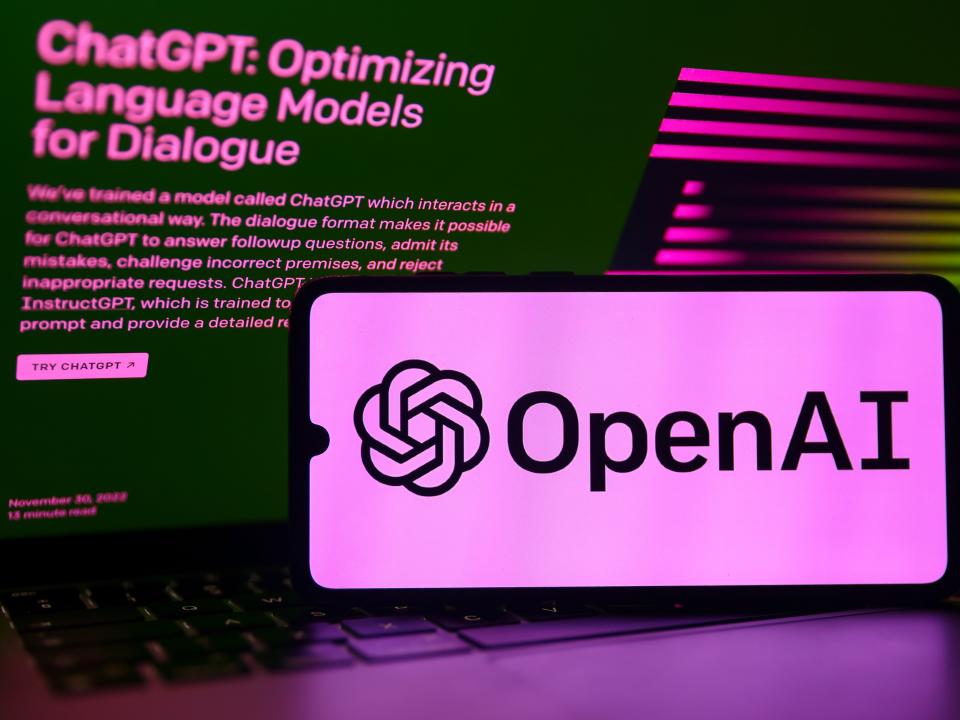 Picture of phone that displays OpenAI logo.