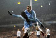 Manchester City's Yaya Toure celebrates with his team-mate Edin Dzeko (right) after scoring his team's second goal 