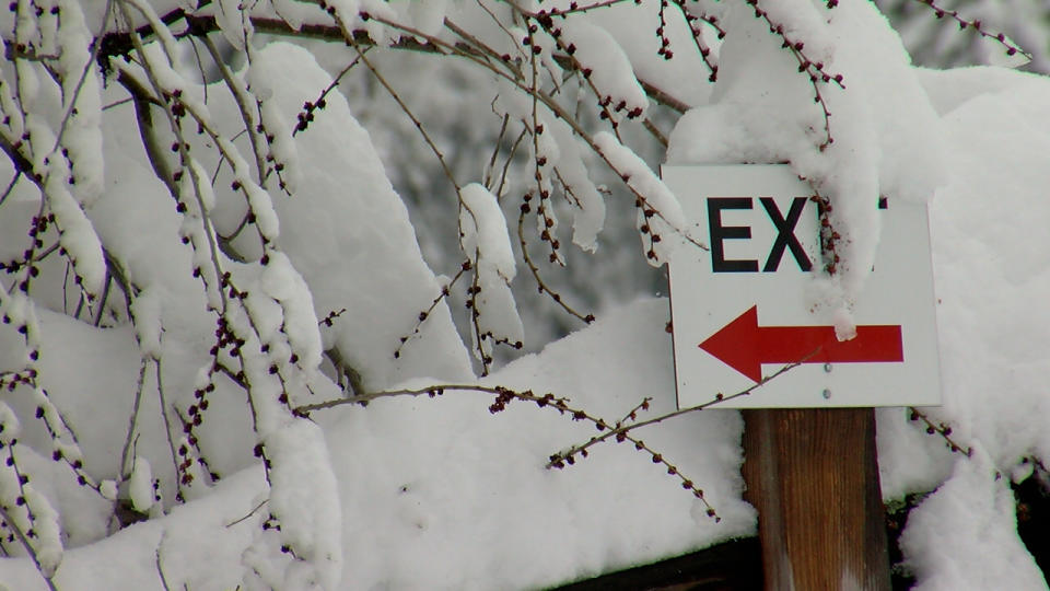 Exit sign covered in snow on the Manitou Springs Incline.