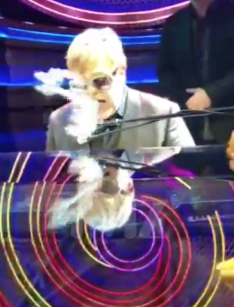 Elton John got a major shock when a fan pelted Mardi Gras beads at his head during a gig in Las Vegas. Photo: TMZ