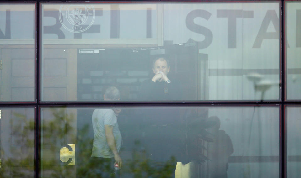 <p>A man looks out of a window at a support center at Manchester City’s Etihad Stadium, Manchester, Britain, May 23, 2017. (Jon Super/Reuters) </p>