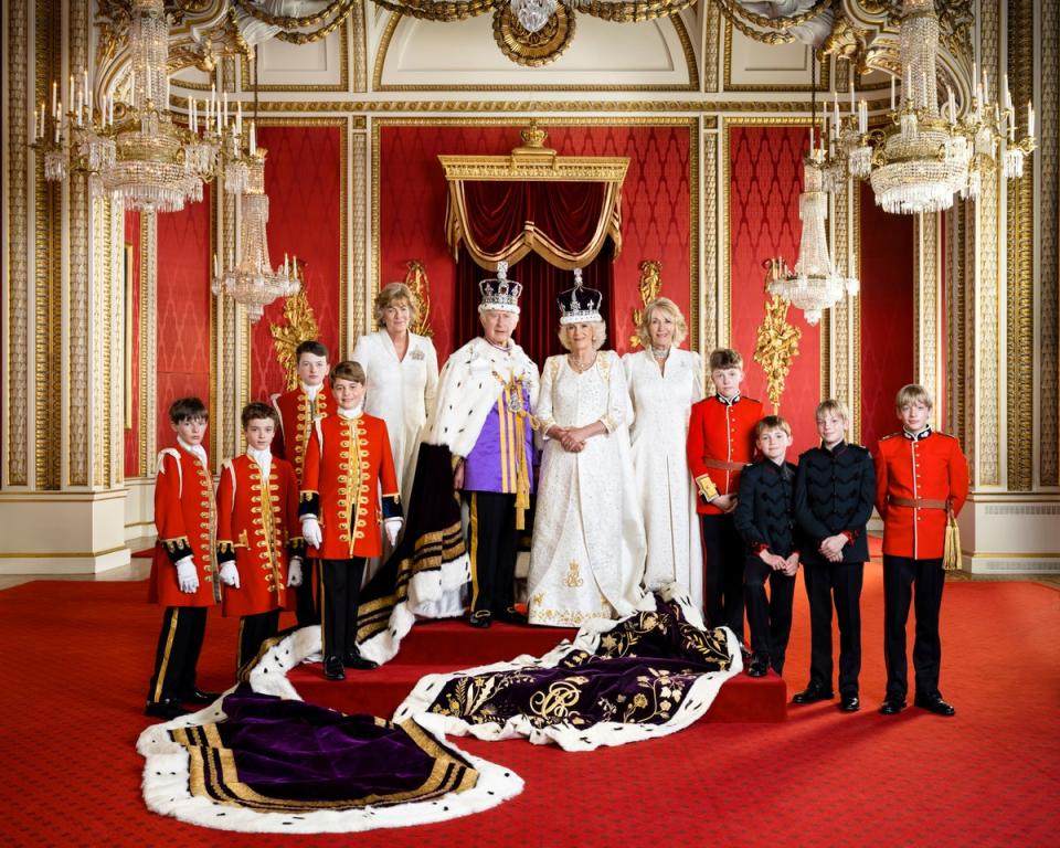King Charle and Queen Camilla with their Pages of Honour and Ladies in Attendance on the day of the coronation in the Throne Room at Buckingham Palac. Pictured (left to right) Ralph Tollemache, Lord Oliver Cholmondeley, Nicholas Barclay, Prince George, the Marchioness of Lansdowne, King Charles III, Queen Camilla, the Queen’s sister Annabel Elliot, the Queen’s grandson Freddy Parker Bowles, the Queen’s great-nephew Arthur Elliot, and the Queen’s grandsons Gus Lopes and Louis Lopes (PA Wire)