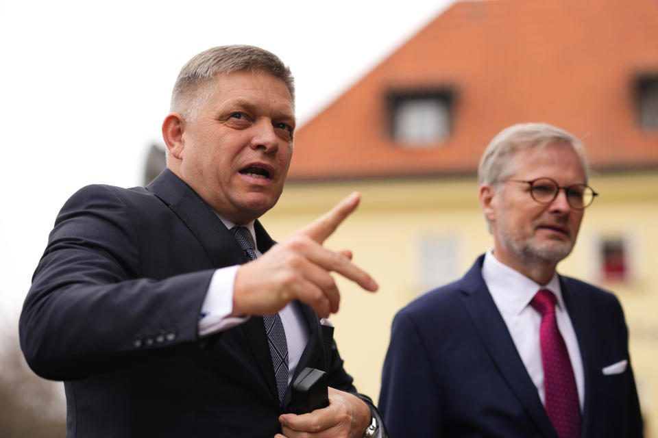 Czech Republic's Prime Minister Petr Fiala, right, welcomes Slovakia's Prime Minister Robert Fico at the V4 meeting in Prague, Czech Republic, Tuesday, Feb. 27, 2024. (AP Photo/Petr David Josek)
