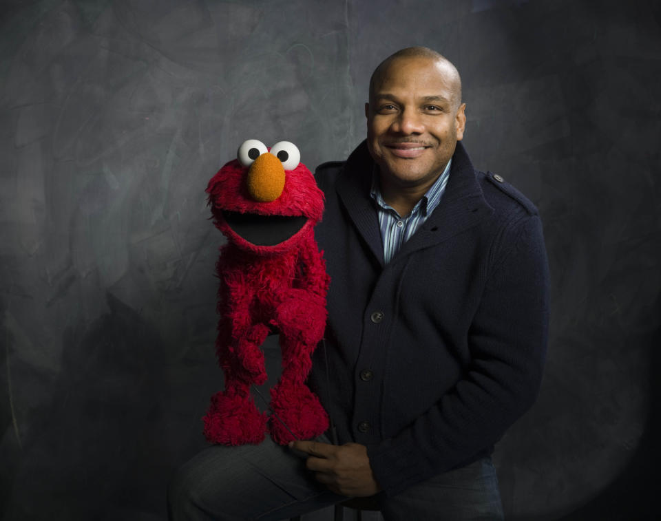 FILE - This Jan. 24, 2011 file photo shows Elmo and puppeteer Kevin Clash of the film "Being Elmo" poses for a portrait in the Fender Music Lodge during the 2011 Sundance Film Festival in Park City, Utah. Clash is being sued by a man who claims the entertainer lured him into drug-fueled sex when he was 16. Sheldon Stephens, who's now 24, says he met Kevin Clash at a networking event. He says he was brought by limousine from Pennsylvania to a New York apartment. There, Clash allegedly smoked crystal meth while giving the teenager another recreational drug. Stephens first made the allegations last year, but recanted after failed efforts to reach a settlement. He renewed the accusations in a lawsuit filed Monday, March 18, 2013, in federal court in Pennsylvania. (AP Photo/Victoria Will, file)