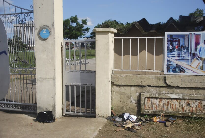 A view of sandles outside Kings Assembly Pentecostal church, following a stampede in Port Harcourt, Nigeria, Saturday, May 28, 2022. Police say a stampede at a church charity event in southern Nigeria has left at least 31 people dead and seven injured. One witness said the dead included a pregnant woman and "many children." Police said the stampede took place at an annual "Shop for Free" program organized by the Kings Assembly Pentecostal church in Rivers state. Such events are common in Nigeria, (AP Photo)