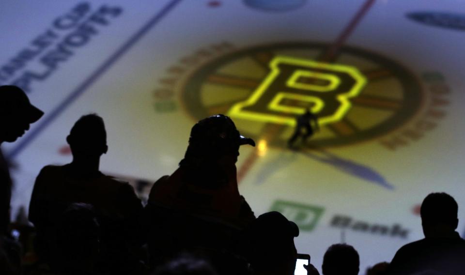 Fans wait for Game 5, between the Boston Bruins and Montreal Canadiens, in the second-round of the Stanley Cup hockey playoff series in Boston, Saturday, May 10, 2014. (AP Photo/Charles Krupa)