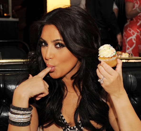 Kim Kardashian konducts herself with klass! We're kurious what Kolor she prefers on her nails...