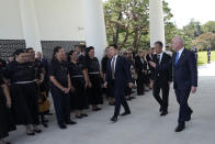 New Zealand's Prime Minister Christopher Luxon, right, waves to members of Maori Kapa Haka during a visit to National Cemetery in Seoul, South Korea, Wednesday, Sept. 4, 2024. (AP Photo/Ahn Young-joon)