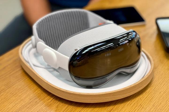 An Apple Vision Pro demo unit on a desk in an Apple Store.