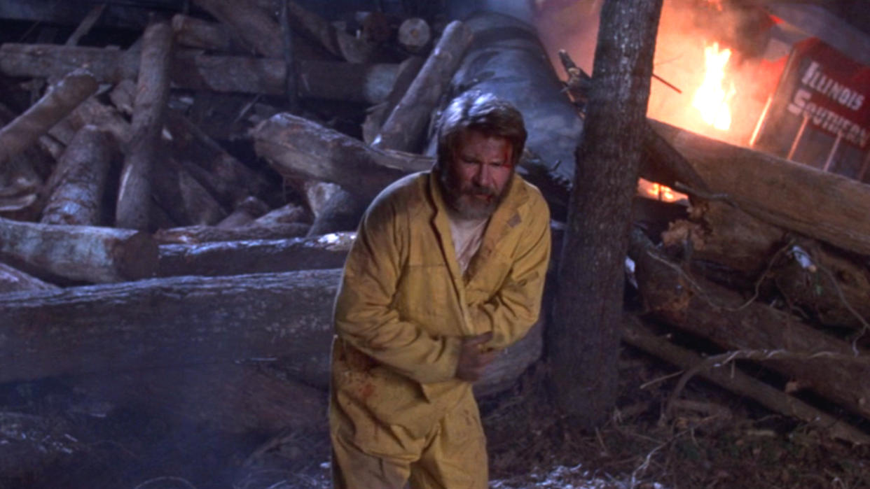  A shaggy looking Harrison Ford limping away from a wrecked train in The Fugitive. 