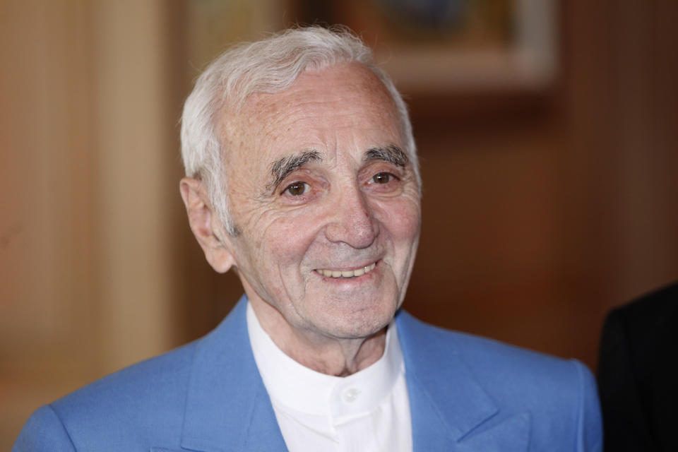 FILE - In this June 6, 2015 file photo, French and Armenian singer, songwriter and actor, Charles Aznavour poses in Cannes, southeastern France. Charles Aznavour, the French crooner and actor whose performing career spanned eight decades, has died. He was 94. (AP Photo/Lionel Cironneau, File)