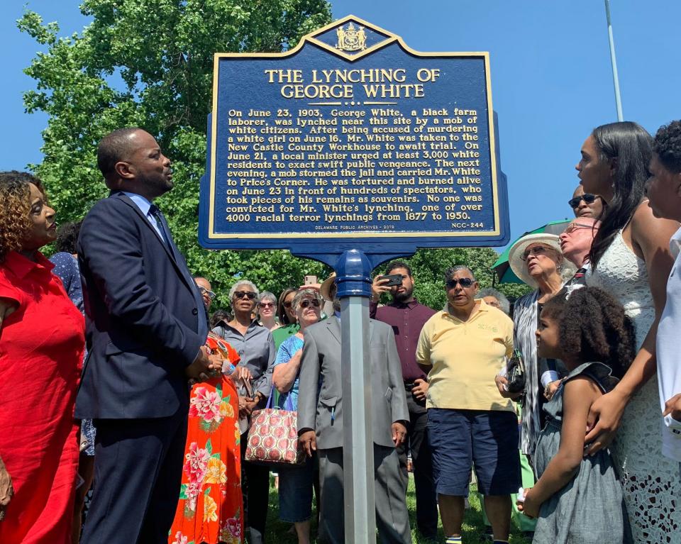 State Sen. Darius Brown and others read the words of a historical marker about the lynching of George White at Greenbank Park in Prices Corner, Del., on June 23.